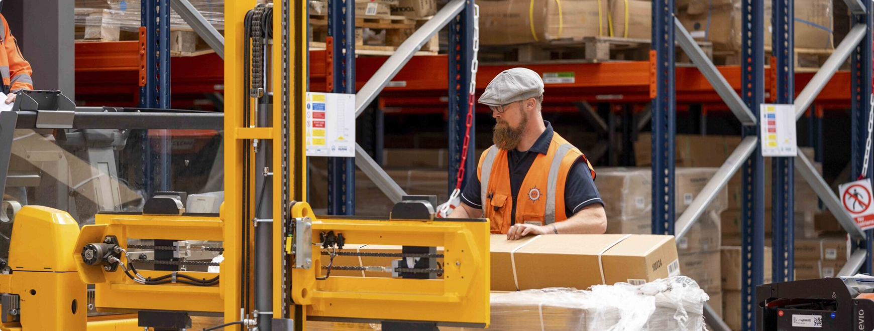 Worker driving Forklift